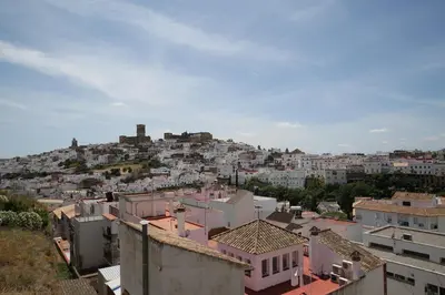 a view of a city with buildings on a hill at Duque de Boliches in Arcos de la Frontera