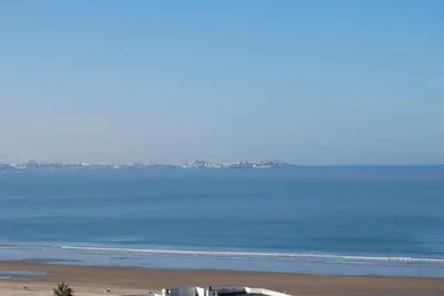 a view of the beach and the ocean at Torre de la Galeona in El Puerto de Santa María