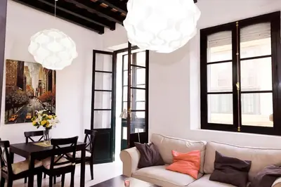 a living room with a couch and a table at Apartamento Centro de Cádiz y Playa in Cádiz