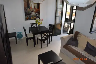 a living room with a couch and a table at Apartamento Centro de Cádiz y Playa in Cádiz