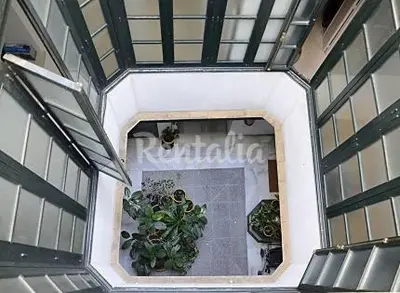 an overhead view of a building with potted plants at Apartamento Centro de Cádiz y Playa in Cádiz