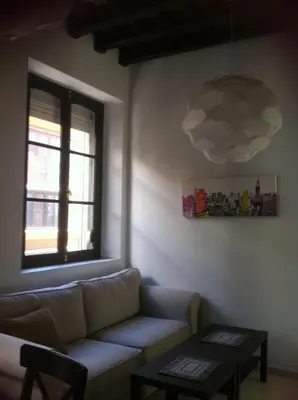 a living room with a couch and a window at Apartamento Centro de Cádiz y Playa in Cádiz