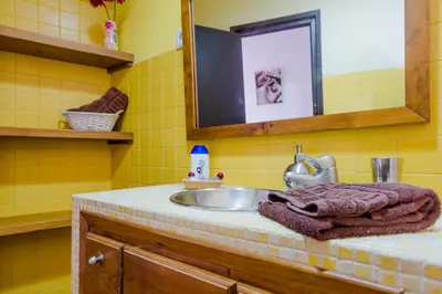 a bathroom with a sink and a mirror at Calma holiday home in Conil de la Frontera
