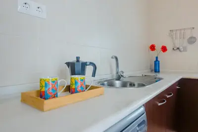 a kitchen counter top with a sink and a counter top at Calma holiday home in Conil de la Frontera