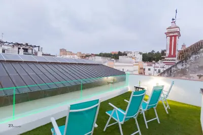 a group of chairs on the roof of a building at Fumiko in Sanlúcar de Barrameda