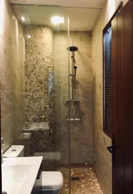 a bathroom with a shower and a toilet and a sink at Avenida Reyes Católicos in Chiclana de la Frontera