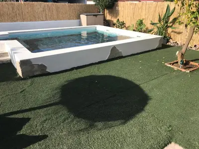 a swimming pool in the middle of a yard at Casa con Piscina en Sanlucar de Barrameda in Sanlúcar de Barrameda