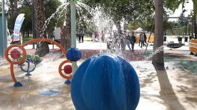 a water fountain with a blue ball in a park at Casa con Piscina en Sanlucar de Barrameda in Sanlúcar de Barrameda