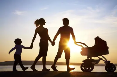 a family walking on the beach with their child at Casa Ros-PLAYA free parking by Cadiz4Rentals in Cádiz