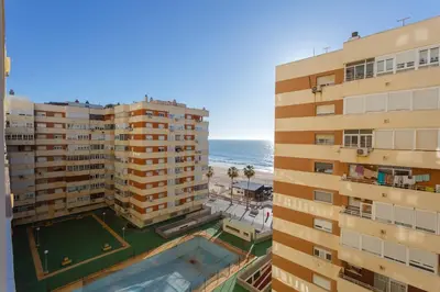 an aerial view of two buildings and the ocean at Casa Ros-PLAYA free parking by Cadiz4Rentals in Cádiz