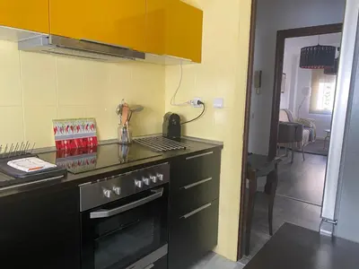 a kitchen with a stove and a counter top at Casa Ana in Sanlúcar de Barrameda