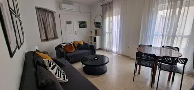 a living room with a couch and a table at apartamento céntrico jerez calle tucan n17 in Jerez de la Frontera