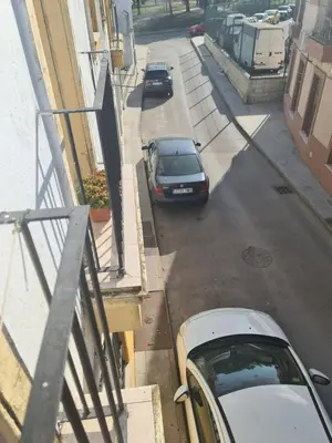 a group of cars parked on a city street at apartamento céntrico jerez calle tucan n17 in Jerez de la Frontera