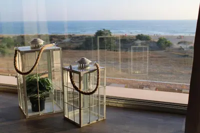 a couple of lanterns in front of a window at Hotel Boutique Aroma de Mar in Chiclana de la Frontera