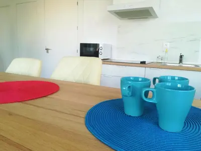 three blue coffee cups sitting on a table at Luz de Cádiz in Cádiz