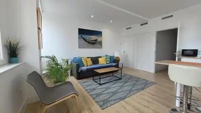 a living room with a couch and a table at Luz de Cádiz in Cádiz