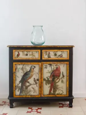 a cabinet with four pictures of birds on it at SH La Casa del Loro. Amplio apartamento. in Cádiz