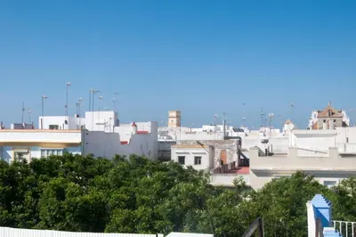 a view of a city skyline with buildings at El mirador del Mentidero in Cádiz