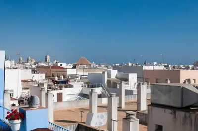 a view of a city from the roof of a building at El mirador del Mentidero in Cádiz