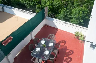 an overhead view of a table and chairs on a balcony at El mirador del Mentidero in Cádiz
