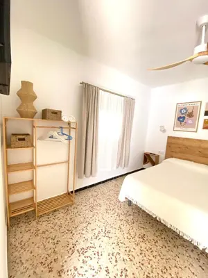 a bedroom with a bed and a window at Hotel Rural Casa Fina - Adults Recommended in Conil de la Frontera