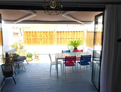 a patio with a table and chairs on a patio at El Palomar de Menacho in Cádiz