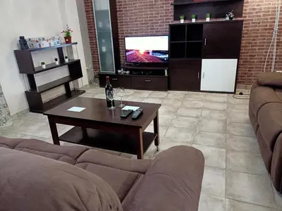 a living room with a couch and a coffee table at Casa Rural Vacacional in Puerto Real