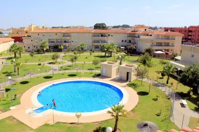an overhead view of a large swimming pool in a resort at Sanlúcar Apart Airen!! in Sanlúcar de Barrameda