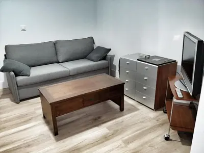a living room with a couch and a coffee table at Casa Crespo in Cádiz