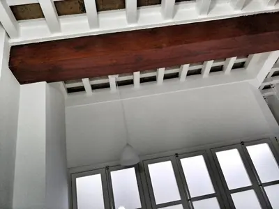 a ceiling in a room with windows at Casa Crespo in Cádiz