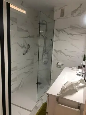 a bathroom with a shower and a sink at Masai Victoria Beach. A 100 metros de la playa. in Cádiz