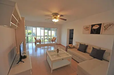 a living room with a couch and a table at Apto Terrazas 3 Rooms 2 baños Cabildo Playa Parking in Sanlúcar de Barrameda