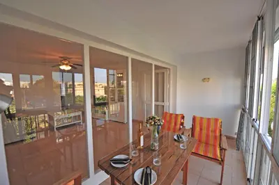 a dining room with a table and chairs at Apto Terrazas 3 Rooms 2 baños Cabildo Playa Parking in Sanlúcar de Barrameda