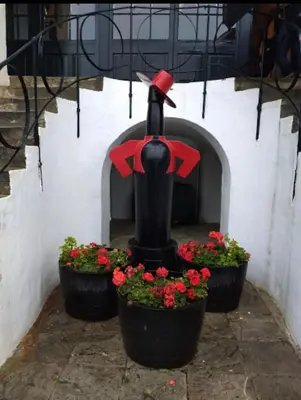 a statue of a person with a bow and flowers at MARIÑIGUEZ APARTAMENT. in Jerez de la Frontera