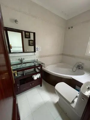 a bathroom with a tub and a toilet and a sink at MARIÑIGUEZ APARTAMENT. in Jerez de la Frontera