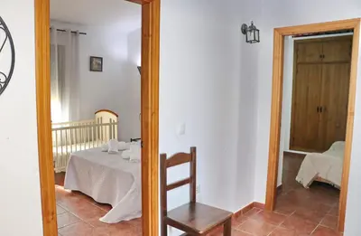 a mirror in a room with a table and a chair at Casa Calas Boliña in Roche