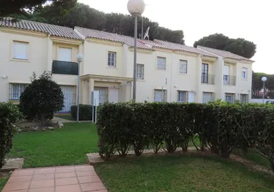 a building with a hedge in front of it at Los Pinos 4 in Chiclana de la Frontera