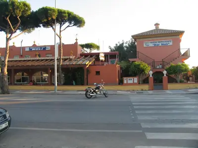 a motorcycle parked in the middle of a street at Hostal Noli in Chiclana de la Frontera