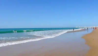 a group of people in the water at the beach at HORIZONTE Sunny Home by Cadiz4Rentals in Cádiz