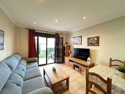a living room with a couch and a table at Coto de Sancti Petri in Chiclana de la Frontera