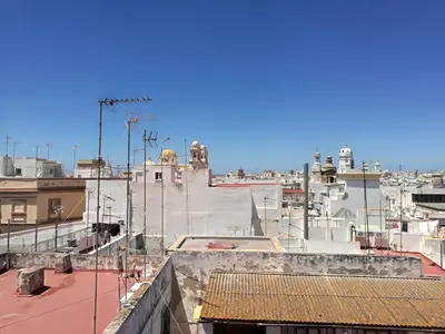 a view of a city from the roofs of buildings at Sopranis del MAR Apartamento centro Cádiz, junto playa y estación in Cádiz