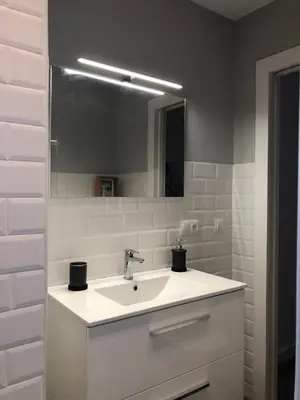 a bathroom with a sink and a mirror at Charito 18 in Cádiz