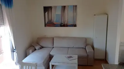 a living room with a couch and a table at Apartamento en rota in Rota