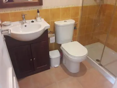 a bathroom with a toilet and a sink at Apartamento en rota in Rota