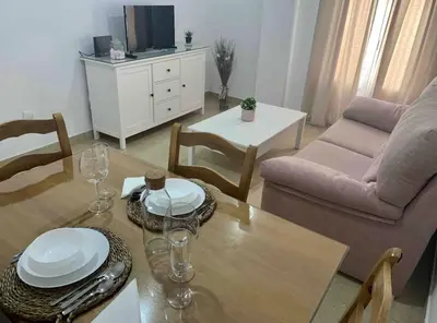a living room with a table and a couch at Apartamento Felisa in Arcos de la Frontera