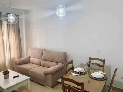 a living room with a couch and a table at Apartamento Felisa in Arcos de la Frontera