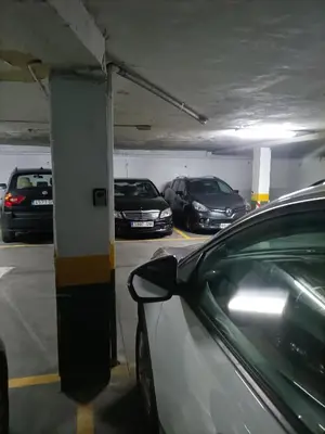 a parking garage with cars parked in it at Cádiz Beach & Kids - free parking - sea views in Cádiz