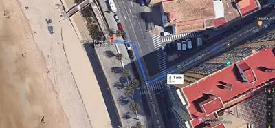 an overhead view of a beach next to a building at Cádiz Beach & Kids - free parking - sea views in Cádiz