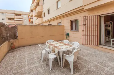 a table and chairs sitting on a patio at Apartamento Centro Jerez in Jerez de la Frontera