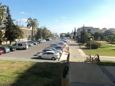 a row of cars parked in a parking lot at Apartamento Centro Jerez in Jerez de la Frontera